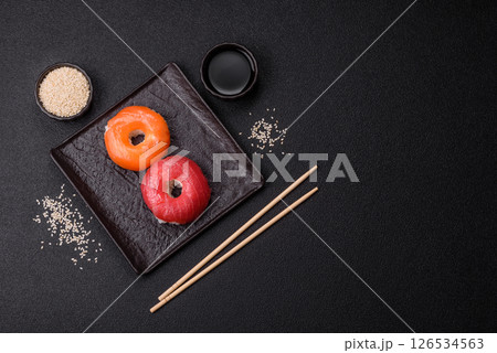 Donut shaped sushi rolls with salmon, shrimp and tuna 126534563