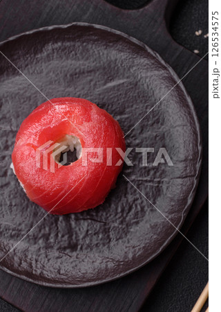 Donut shaped sushi rolls with salmon, shrimp and tuna 126534575