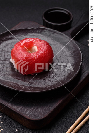 Donut shaped sushi rolls with salmon, shrimp and tuna 126534576