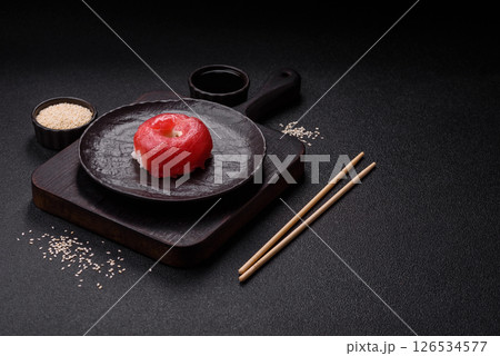 Donut shaped sushi rolls with salmon, shrimp and tuna Donut shaped sushi rolls with salmon, shrimp and tuna 126534577