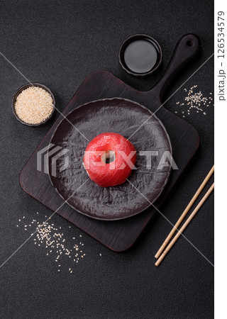 Donut shaped sushi rolls with salmon, shrimp and tuna Donut shaped sushi rolls with salmon, shrimp and tuna 126534579