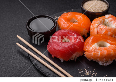 Donut shaped sushi rolls with salmon, shrimp and tuna 126534584