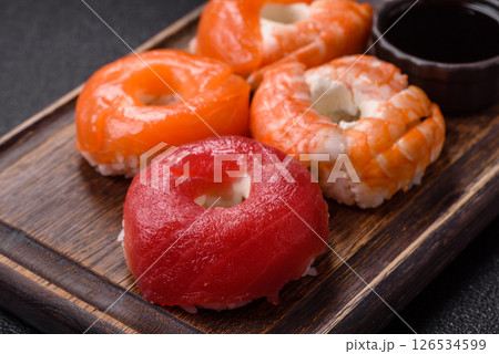 Donut shaped sushi rolls with salmon, shrimp and tuna Donut shaped sushi rolls with salmon, shrimp and tuna 126534599