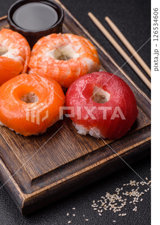 Donut shaped sushi rolls with salmon, shrimp and tuna 126534606