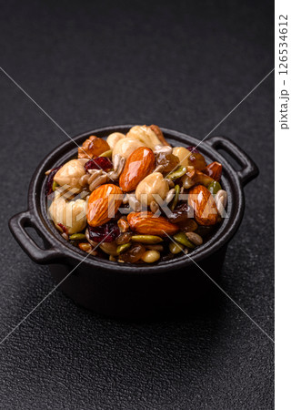 Honeyed cashew nuts, walnuts, hazelnuts, pine nuts and dried fruits Honeyed cashew nuts, walnuts, hazelnuts, pine nuts and dried fruits 126534612