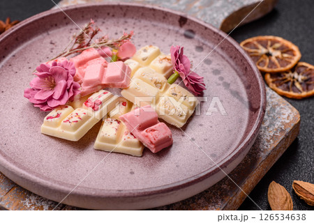 Multicolored handmade chocolate bars pink, white, brown colors 126534638