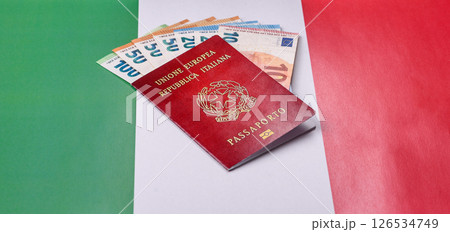 Italian citizen passport against the background of the national flag of Italy 126534749