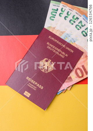 German citizen passport against the background of the German national flag German citizen passport against the background of the German national flag 126534766