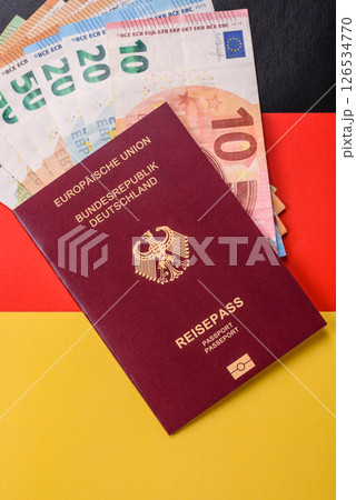 German citizen passport against the background of the German national flag German citizen passport against the background of the German national flag 126534770