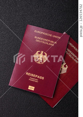 German citizen passport against the black textured background 126534782