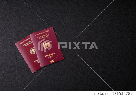 German citizen passport against the black textured background 126534789