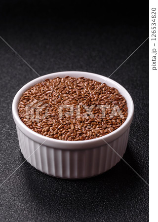 Flax seeds in a bowl, an ingredient for making vegan or vegetarian food Flax seeds in a bowl, an ingredient for making vegan or vegetarian food 126534820