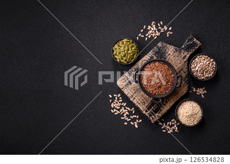 Flax seeds in a bowl, an ingredient for making vegan or vegetarian food Flax seeds in a bowl, an ingredient for making vegan or vegetarian food 126534828
