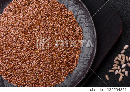Flax seeds in a bowl, an ingredient for making vegan or vegetarian food Flax seeds in a bowl, an ingredient for making vegan or vegetarian food 126534851