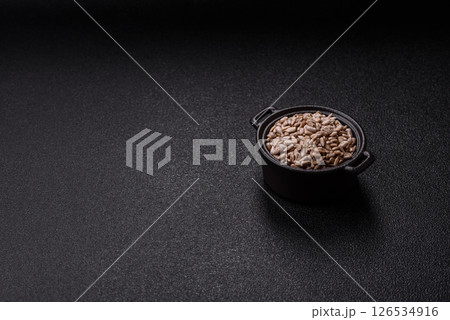 Peeled sunflower seeds in a bowl, an ingredient for making vegetarian food 126534916