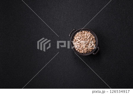 Peeled sunflower seeds in a bowl, an ingredient for making vegetarian food 126534917