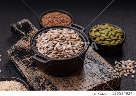 Peeled sunflower seeds in a bowl, an ingredient for making vegetarian food Peeled sunflower seeds in a bowl, an ingredient for making vegetarian food 126534924