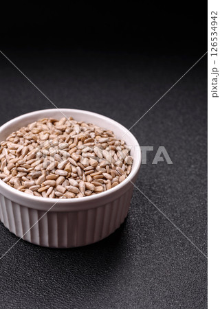 Peeled sunflower seeds in a bowl, an ingredient for making vegetarian food 126534942