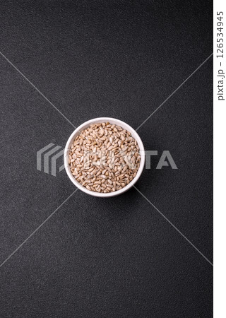 Peeled sunflower seeds in a bowl, an ingredient for making vegetarian food Peeled sunflower seeds in a bowl, an ingredient for making vegetarian food 126534945