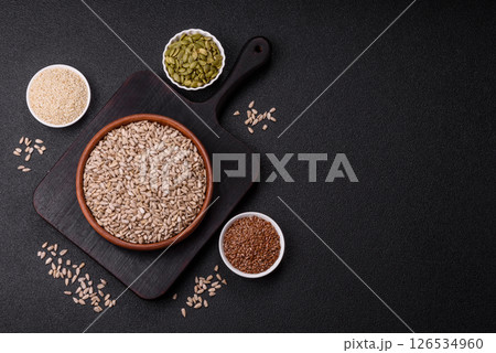 Peeled sunflower seeds in a bowl, an ingredient for making vegetarian food Peeled sunflower seeds in a bowl, an ingredient for making vegetarian food 126534960