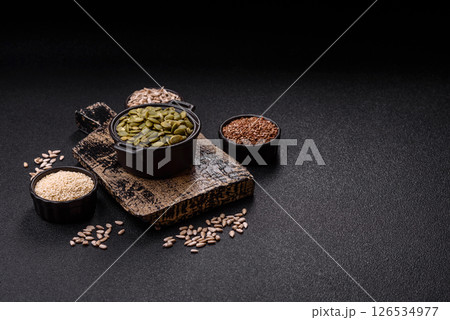 Peeled pumpkin seeds in a bowl, an ingredient for making vegetarian food Peeled pumpkin seeds in a bowl, an ingredient for making vegetarian food 126534977