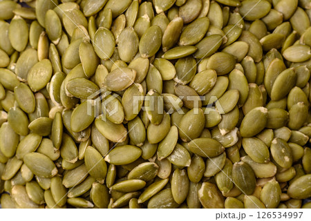 Peeled pumpkin seeds in a bowl, an ingredient for making vegetarian food 126534997