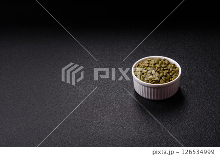 Peeled pumpkin seeds in a bowl, an ingredient for making vegetarian food Peeled pumpkin seeds in a bowl, an ingredient for making vegetarian food 126534999