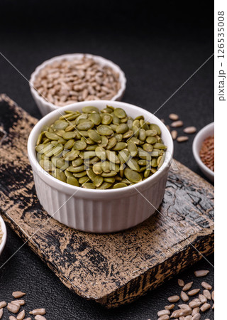Peeled pumpkin seeds in a bowl, an ingredient for making vegetarian food 126535008
