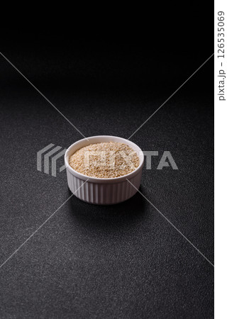 White sesame seeds in a bowl, an ingredient for making vegetarian food 126535069