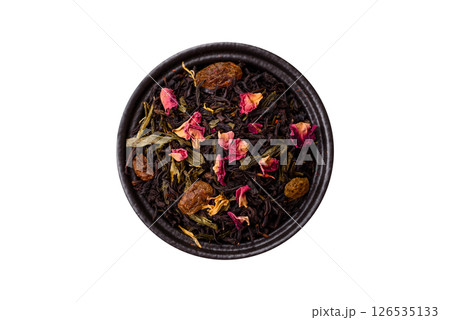 Dry tea mix blend black, green and flower petals in bowl 126535133