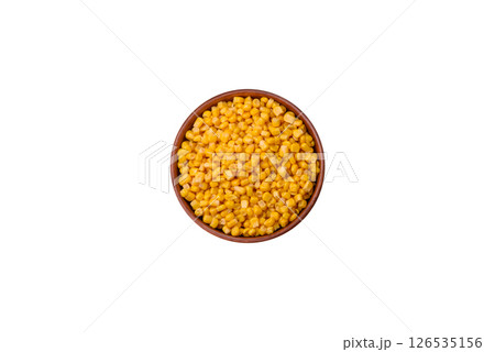 Sweet yellow canned corn in bowl 126535156