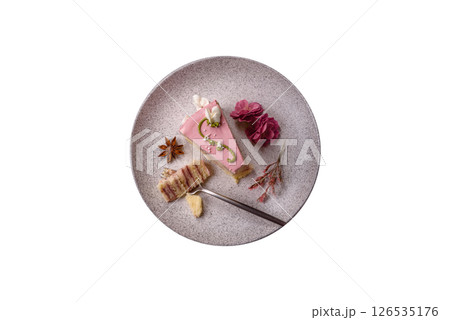 A piece of pink layered cake with strawberry flavor A piece of pink layered cake with strawberry flavor 126535176