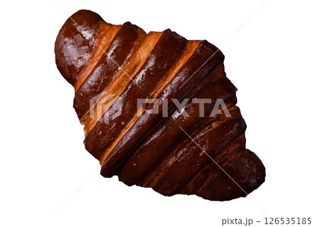 Sweet fresh crispy croissant with chocolate filling 126535185