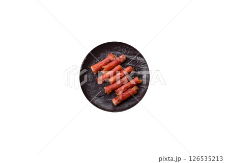 Cheese and meat, jamon or prosciutto rolled into a roll Cheese and meat, jamon or prosciutto rolled into a roll 126535213