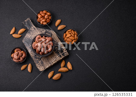 Cashew nuts in shell in bowl 126535331