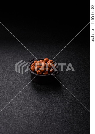 Raw hazelnuts without shells in a bowl 126535382