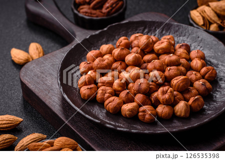 Raw hazelnuts without shells in a bowlの写真素材 [126535398] - PIXTA