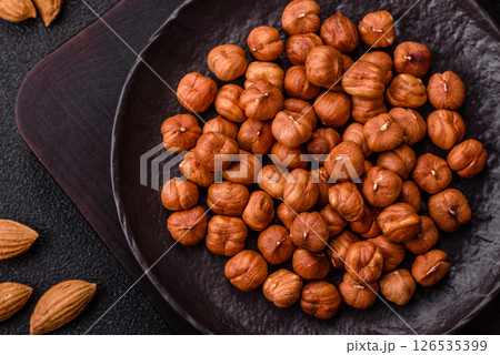 Raw hazelnuts without shells in a bowl 126535399
