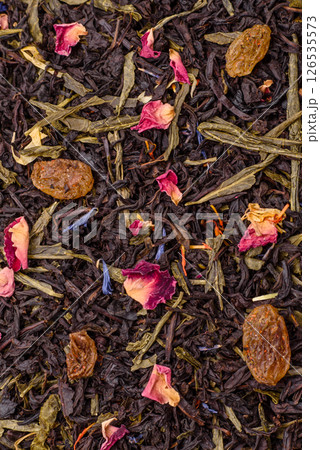 Dry tea mix blend black, green and flower petals in bowl Dry tea mix blend black, green and flower petals in bowl 126535573