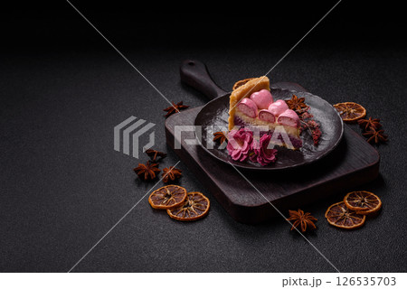 Sweet cheesecake with berry flavor, decorated with pink hearts 126535703