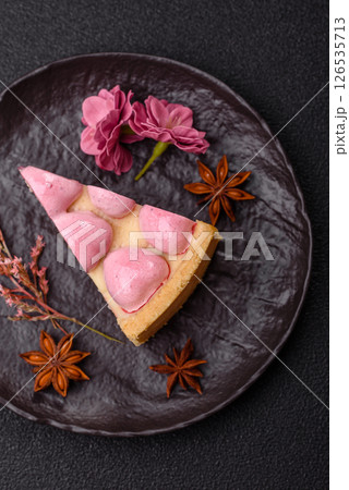 Sweet cheesecake with berry flavor, decorated with pink hearts 126535713