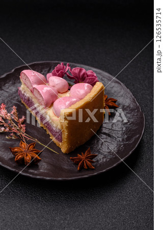 Sweet cheesecake with berry flavor, decorated with pink hearts 126535714