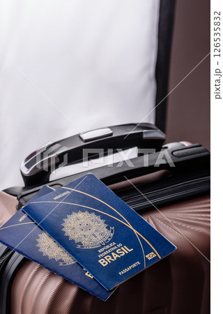 International passport of a citizen of Brasil on a suitcase 126535832