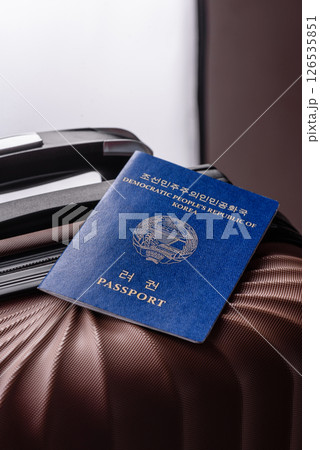 International passport of a citizen of North Korea on a suitcase 126535851