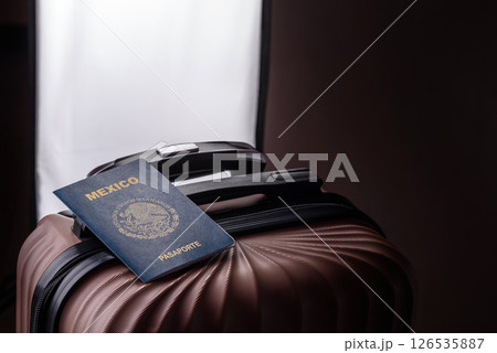 International passport of a citizen of Mexico on a suitcase International passport of a citizen of Mexico on a suitcase 126535887