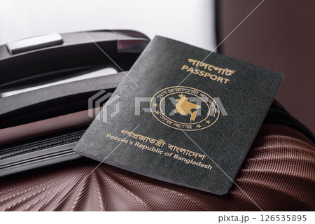 International passport of a citizen of Bangladesh on a suitcase International passport of a citizen of Bangladesh on a suitcase 126535895