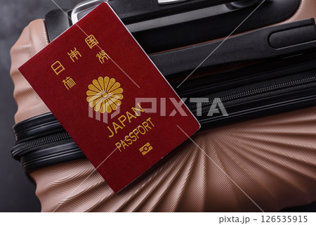 International passport of a citizen of Japan on a suitcase 126535915