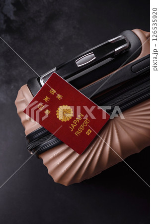 International passport of a citizen of Japan on a suitcase 126535920