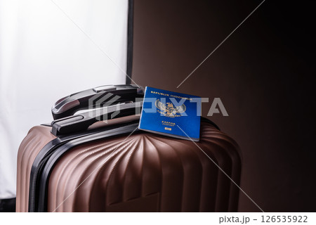 International passport of a citizen of Indonesia on a suitcase International passport of a citizen of Indonesia on a suitcase 126535922