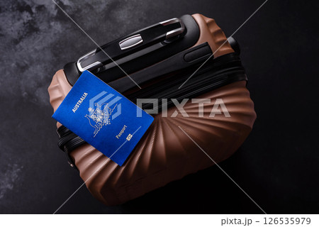 International passport of a citizen of Australia on a suitcase 126535979